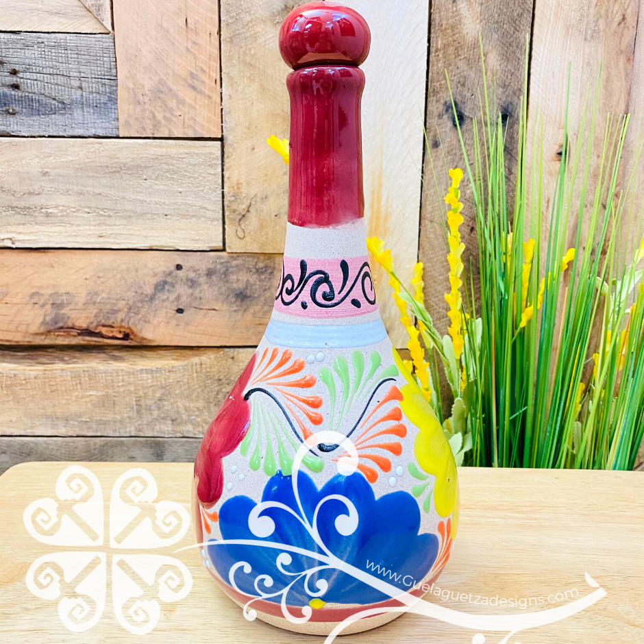 Floreada Garifa Tequilero - Tequila Clay Bottle – Guelaguetza Designs Floreada Garifa Tequilero - Tequila Clay Bottle – Guelaguetza Designs